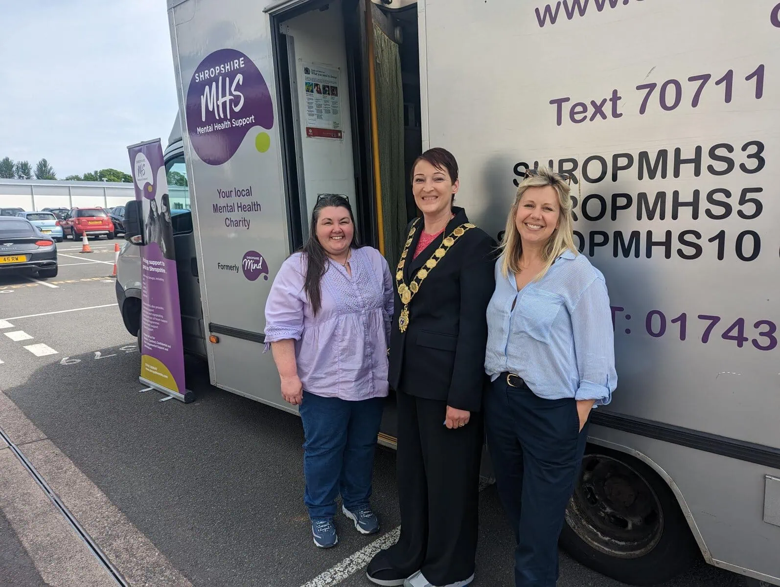Mayor supporting outside MHS van