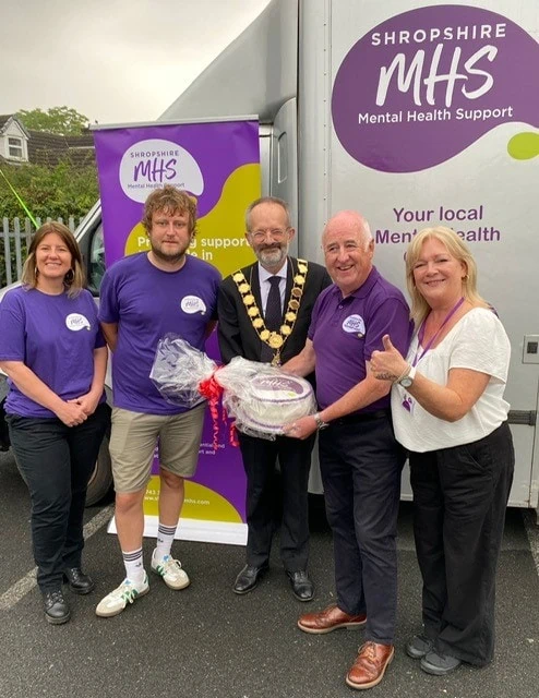 Mayor standing between Shropshire MHS staff at fundraiser
